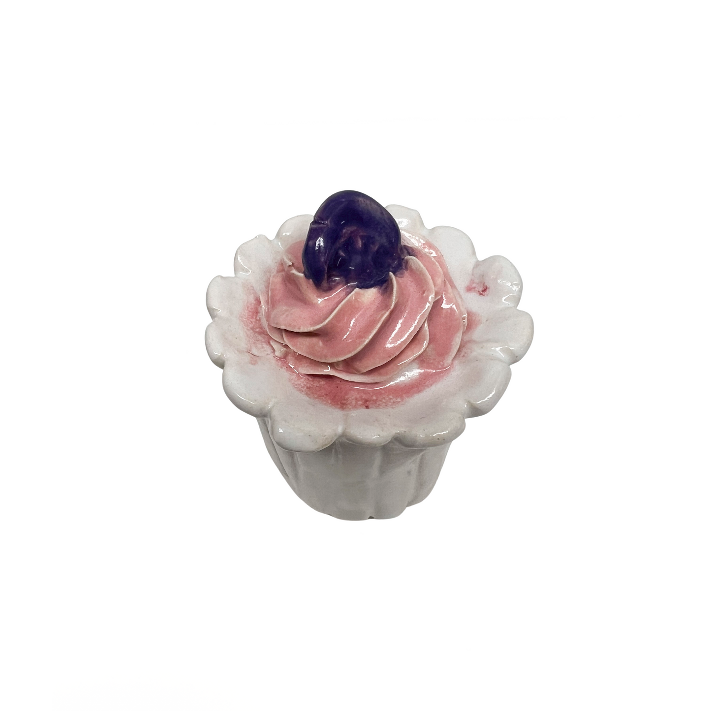 White Cupcake With Pink Frosting And Purple Medallion