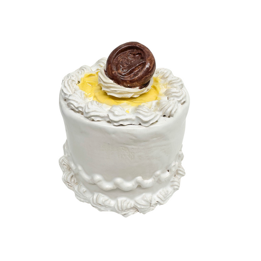 White Petite Cake With Lemon Topping And Chocolate Candy