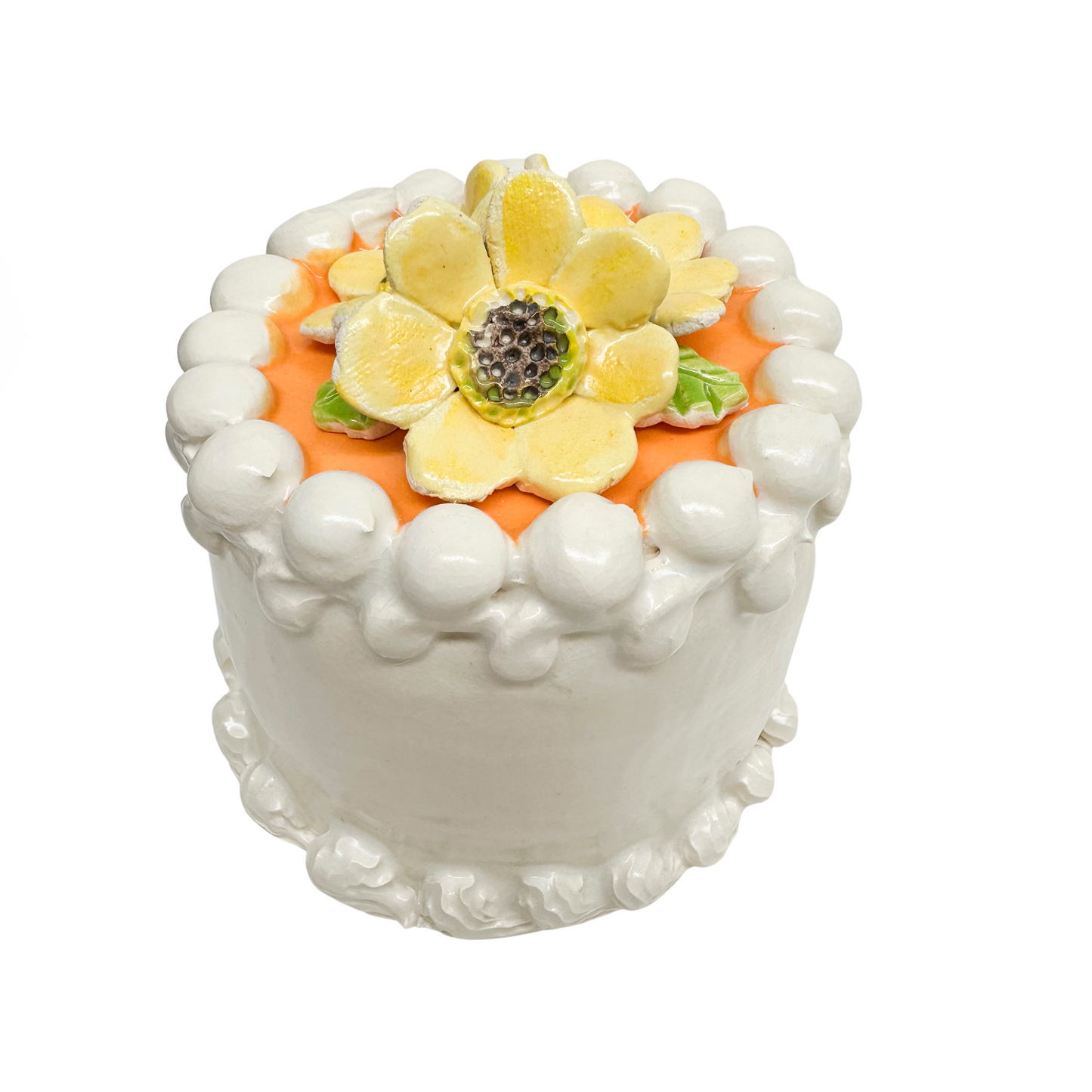 White Petite Cake With Orange Topping And Yellow Flowers